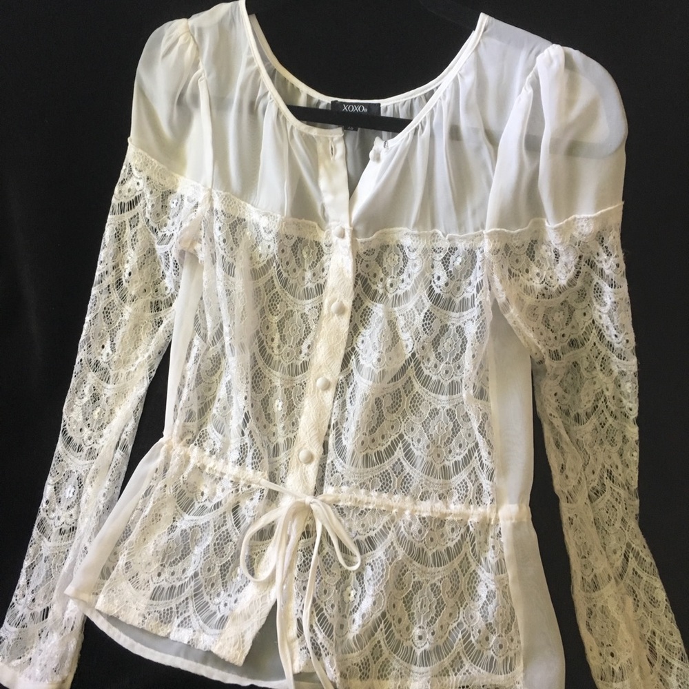 A sheer XS white long sleeve blouse.
